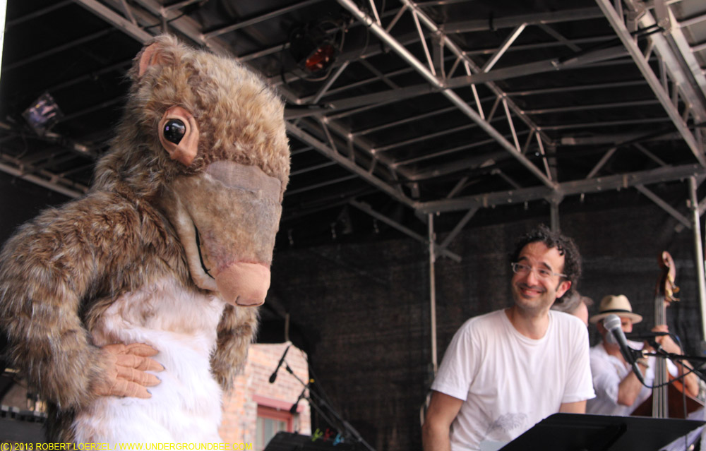 The key mammal that survived the meteor explosion that killed off the dinosaurs — the shrewdinger — appears during "Radio Lab," with Jad Abumrad, right.